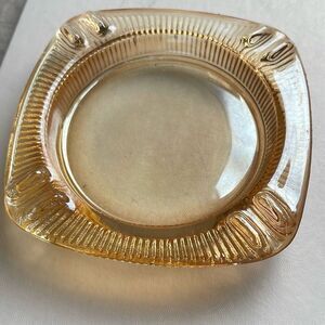 Vintage mid century Carnival glass ashtray. Peach in color.